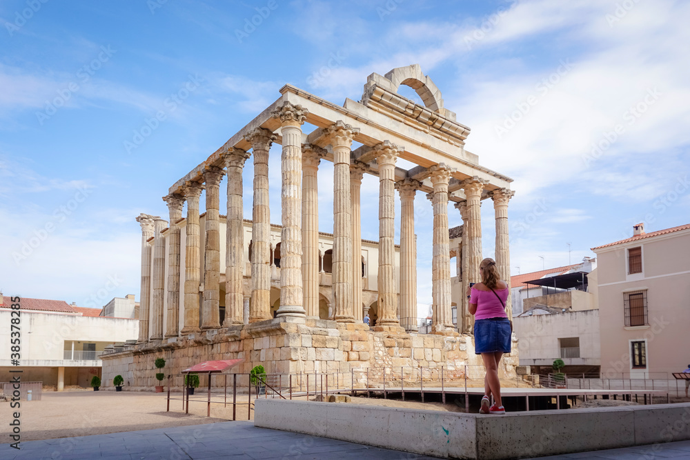 Woman photographing buildings from the Roman era of the city of Merida in Spain Woman photographing buildings from the Roman era of the city of Merida in Spain