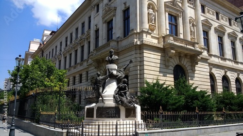 Monument to Eugeniu Carada near a historic building in Bucharest. Romania. Europe