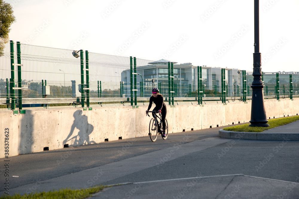 Fototapeta premium Morning cycling workout in the city. Outdoor cycling.