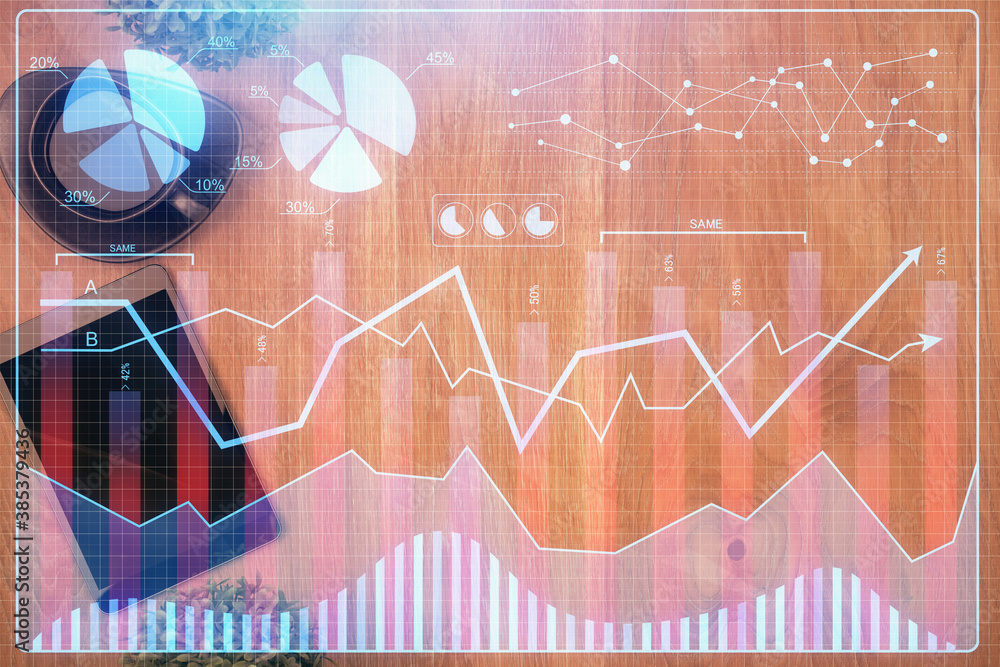 Multi exposure of financial chart hologram over desktop with phone. Top view. Mobile trade platform concept. Multi exposure of financial chart hologram over desktop with phone. Top view. Mobile trade platform concept.