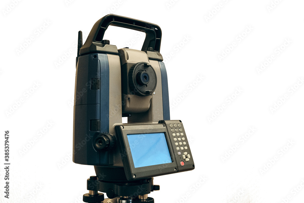 Total station isolated on white background. Electronic total station - modern geodetic instrument for measuring distances, horizontal and vertical angles. Total station isolated on white background. Electronic total station - modern geodetic instrument for measuring distances, horizontal and vertical angles.