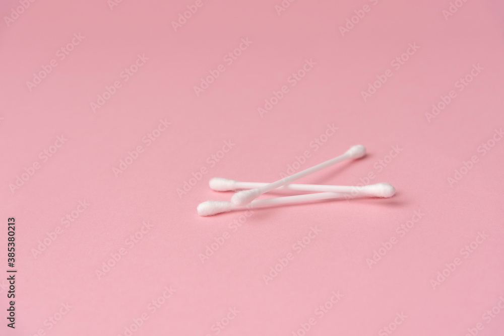 ear sticks on a pink background ear sticks on a pink background