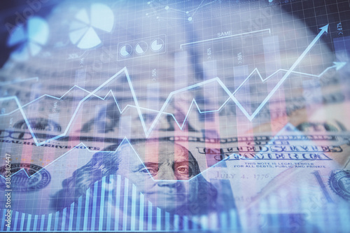 Double exposure of forex graph drawing over us dollars bill background. Concept of financial markets.