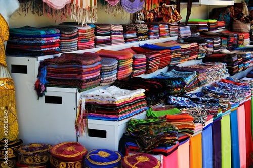 Turkish market with colorful shawls, carpets and souvenirs © Mateusz Misztal
