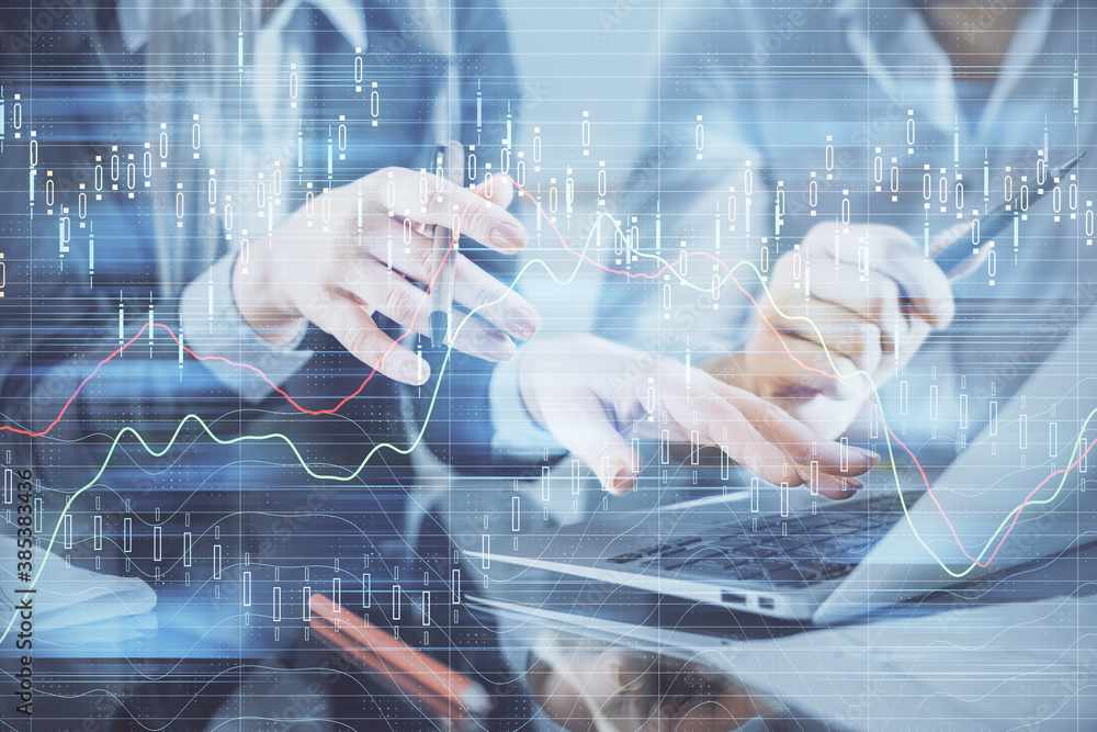 Multi exposure of man and woman working together and financial chart hologram. Business concept. Computer background. Multi exposure of man and woman working together and financial chart hologram. Business concept. Computer background.