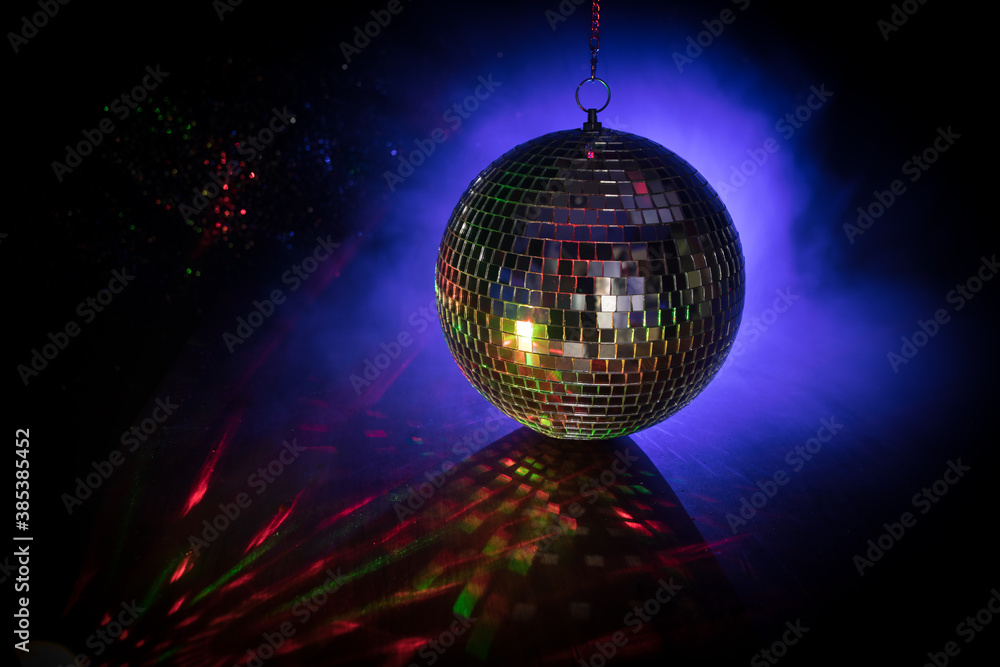 Fototapeta premium Colorful disco mirror ball lights night club background. Party lights disco ball. Selective focus