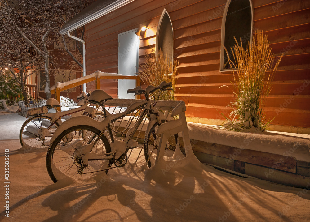 Bicycles at a back door in winter at Camnore, Alberta, Canada