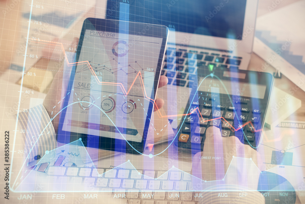 Double exposure of man's hands holding and using a digital device and forex graph drawing. Financial market concept. Double exposure of man's hands holding and using a digital device and forex graph drawing. Financial market concept.