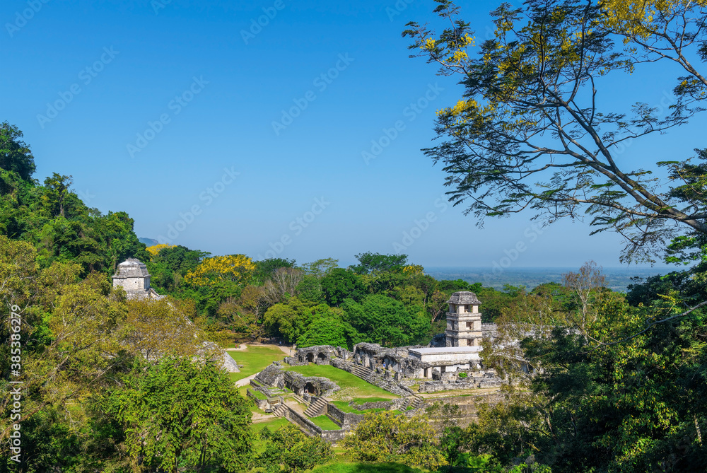 Cityscape of the Maya ruin Palenque in the rainforest with the Temple of Inscriptions pyramid and the Palace, Chiapas, Mexico.