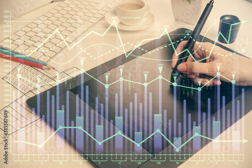 Double exposure of financial graph sketch hologram and woman holding and using a mobile device. Stock exchange concept. © peshkova