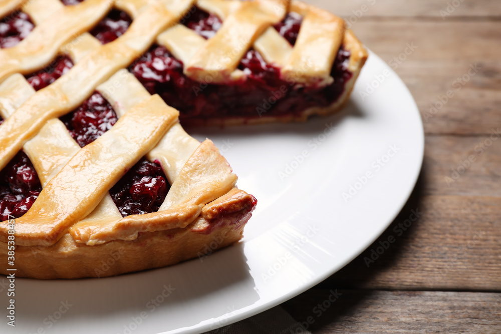 Delicious fresh cherry pie on wooden table, closeup Delicious fresh cherry pie on wooden table, closeup
