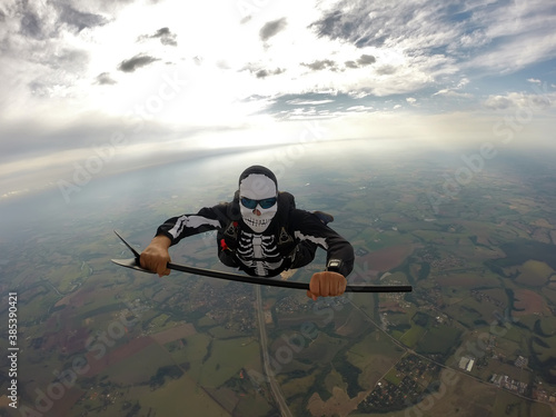 Parachutist dressed for the Helloween in free fall.