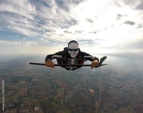 Parachutist dressed for the Helloween in free fall.
