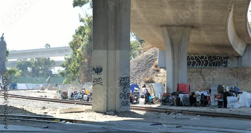 Trash and homeless encampment under a bridge in Los Angeles