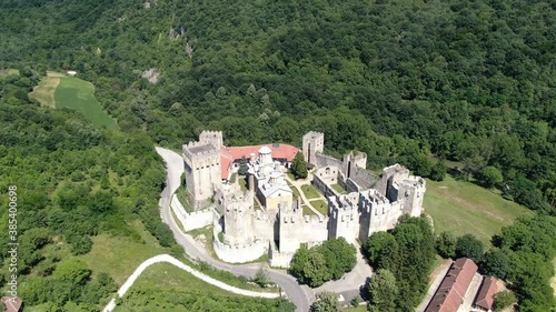 Aerial View, Manasija Orthodox Christian Monastery in Green Landscape of Serbia. 15th Century Landmark and Fortification Near Despotovac City on Sunny Summer Day photo