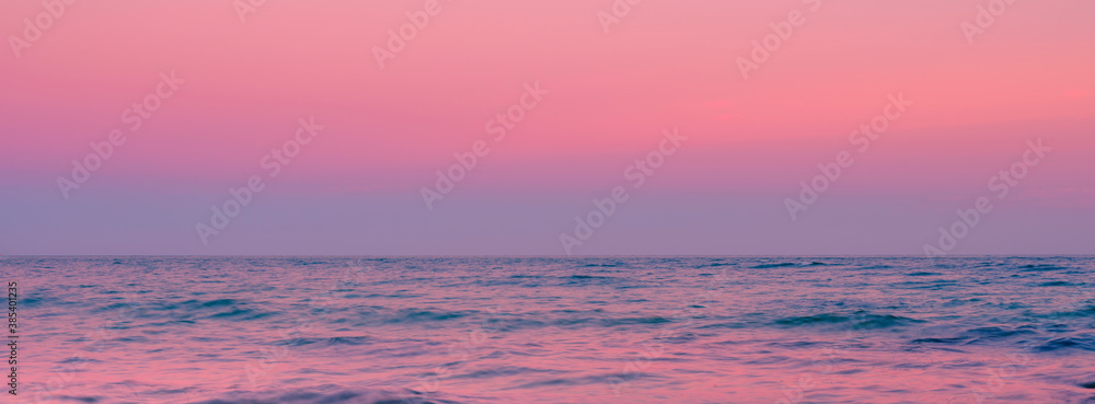 Foggy Twilight Seascape over the Horizon on Martha's Vineyard in Autumn. Selective focus panoramic image with motion blur of the waves.