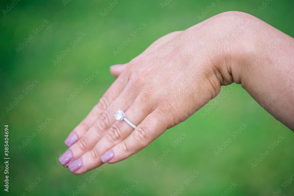 Hand of newly engaged woman displaying diamond ring Hand of newly engaged woman displaying diamond ring