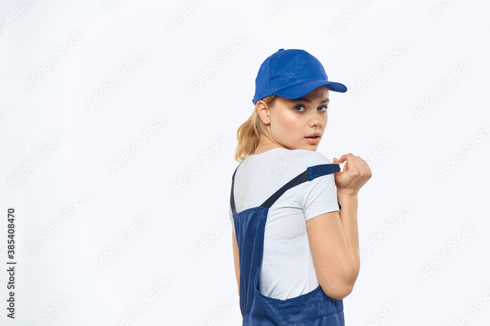 Woman in working uniform blue cap delivery courier delivery service Woman in working uniform blue cap delivery courier delivery service