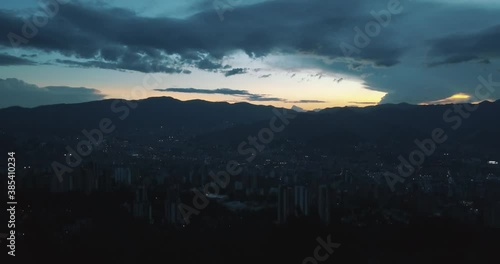 Drone aerial of Medellin city during sunset in Colombia, South america - Dusk time photo