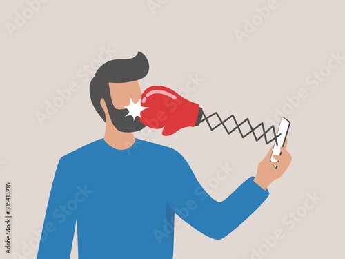 Cyber bullying, online harassment using social media to threatened people, violent using electronic means concept, sad man using social media and being punched by boxing gloves from mobile phone.