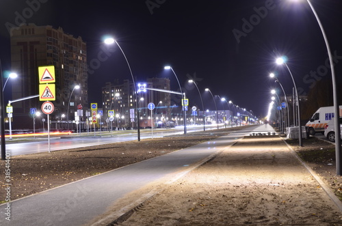 Road and lanterns in the night city