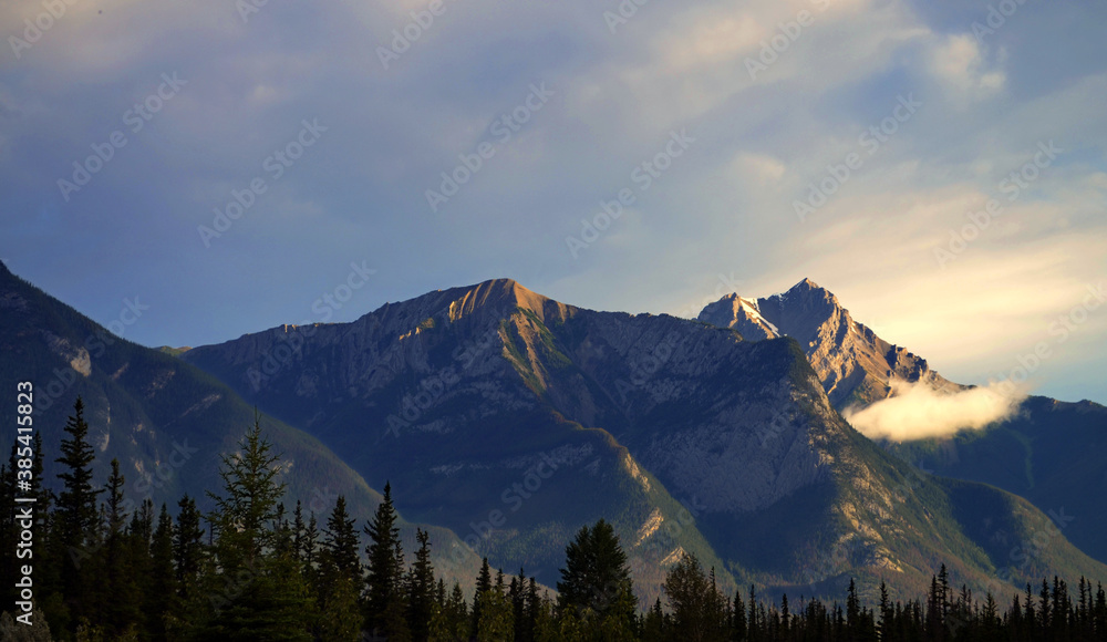 Alberta, Canada - Mountain Peaks looming over Snaring Overflow Campground
