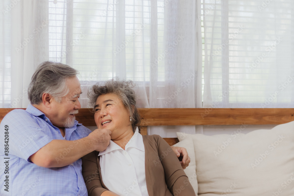 Asian happy retired senior smiling cute eldery couple enjoying & laughing dancing together in home. Romantic relationship of lovely & beautiful marriage lover with happiness lifestyle after retirement Asian happy retired senior smiling cute eldery couple enjoying & laughing dancing together in home. Romantic relationship of lovely & beautiful marriage lover with happiness lifestyle after retirement