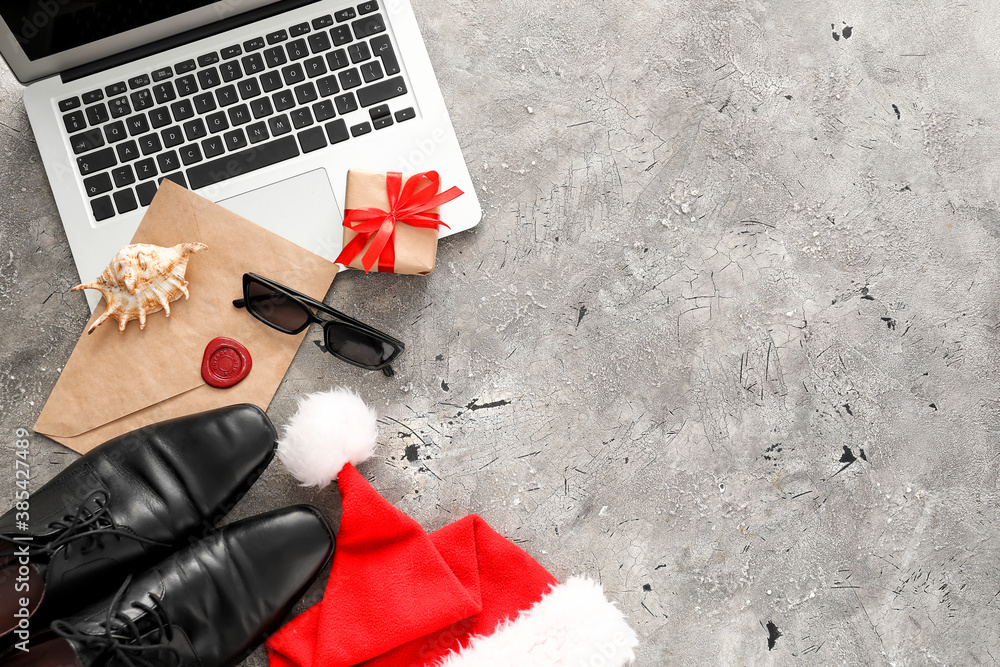 Composition with Santa hat, laptop and male accessories on grey background - obrazy, fototapety, plakaty 