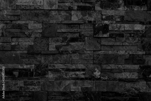 Black brick building wall. Interior of a modern loft. Background for design and interview recording.