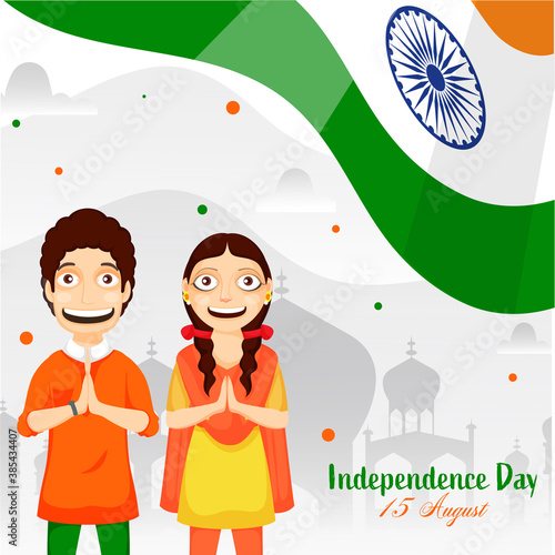 Cheerful Young Boy and Girl Doing Namaste (Welcome) with Wavy Indian Flag on Grey Taj Mahal Background for Independence Day, 15 August. photo