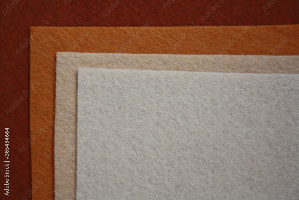 Fototapeta premium Texture of brown felt fabric. Grunge background.