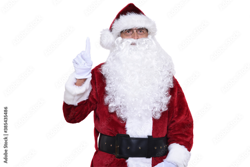 Senior man in traditional Santa Claus costume with one finger pointing up. Number one concept.