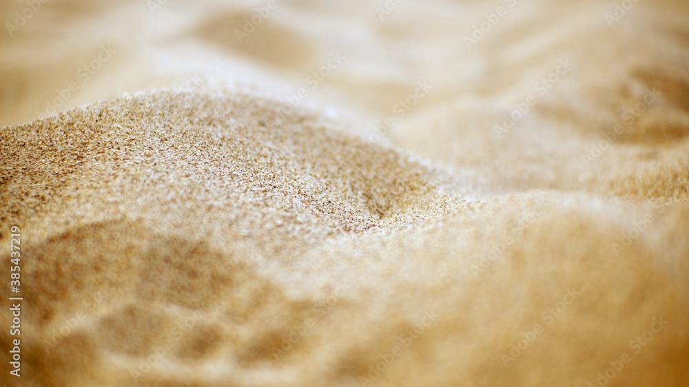 Close-up photo of sand. The sand texture is perfect as a background.
Close-up photo of sand. The sand texture is perfect as a background.