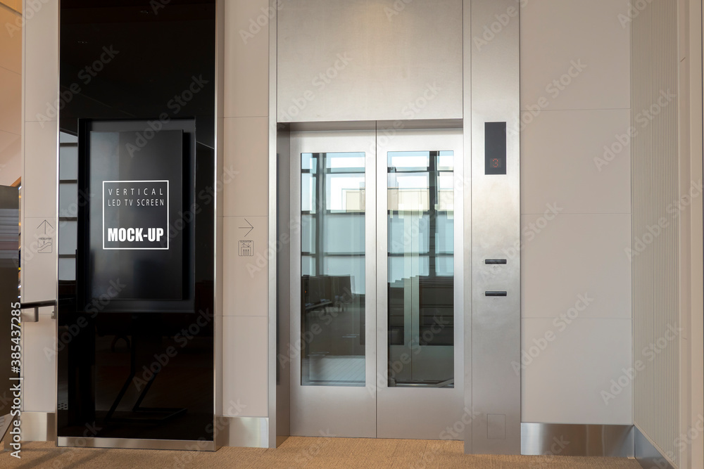 Mock up LED Screen near elevator metallic cabin glass door Mock up LED Screen near elevator metallic cabin glass door