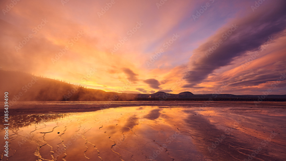 Scenic sunset at Grand Prismatic Spring in Yellowstone National Park, Wyoming, USA.