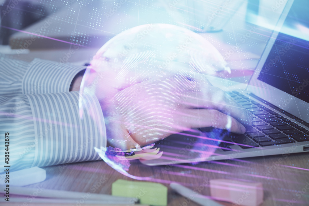 Technology theme hologram with man working on computer on background. High tech concept. Double exposure. Technology theme hologram with man working on computer on background. High tech concept. Double exposure.