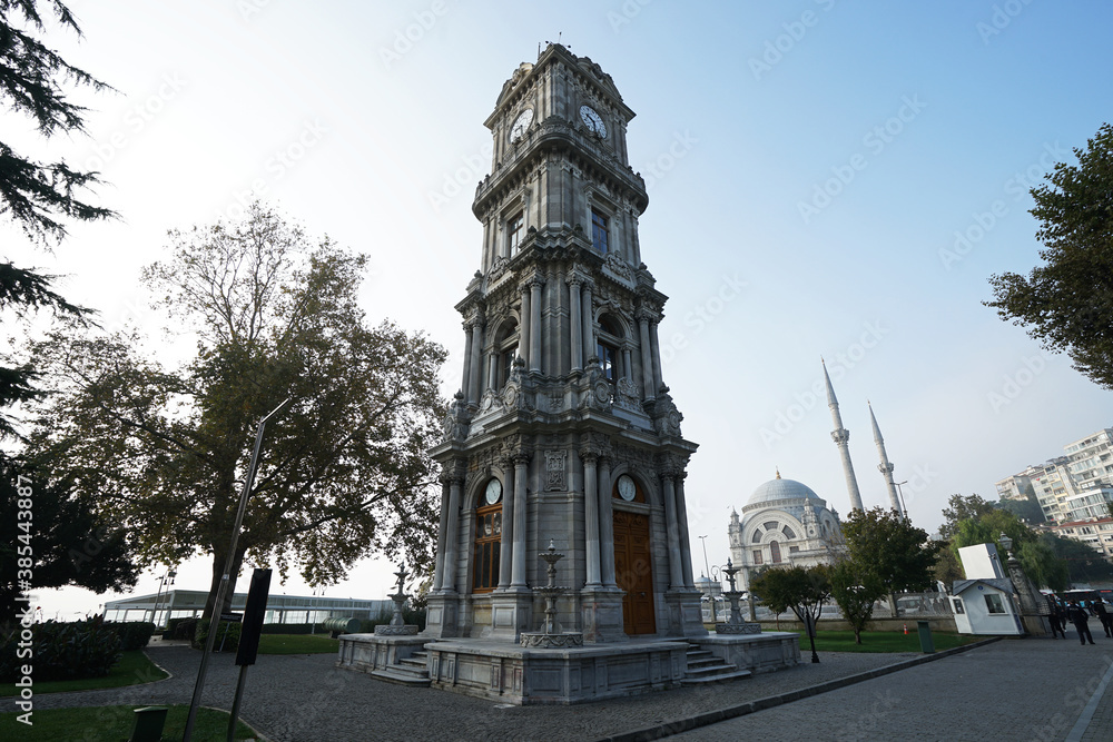 Exterior Neoclassical architecture and clock tower design of 'Dolmabahce imperial palace' located along the European shore of the Bosphorus Strait- Istanbul, Turkey