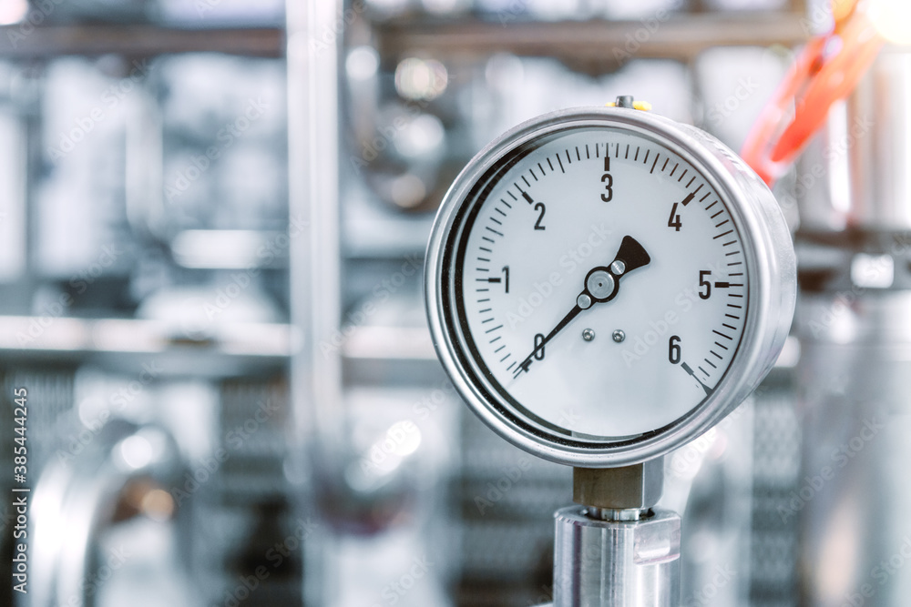 Pressure gauges mounted on the pipeline. Stock Photo | Adobe Stock