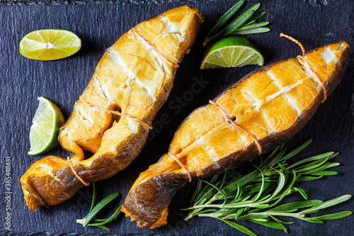 Photography Traditional smoked halibut fish steaks with lime