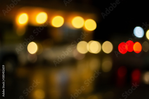 Christmas and Happy new year on blurred bokeh lights on black background. © Keopaserth