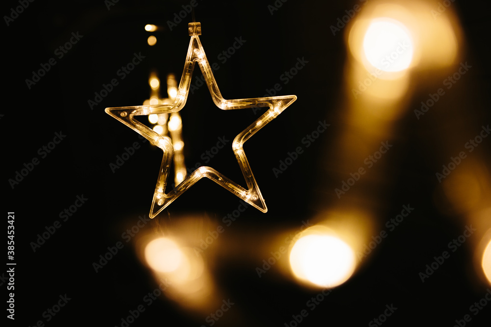 Christmas lights on dark background. Star shaped Christmas lights on dark background. Star shaped