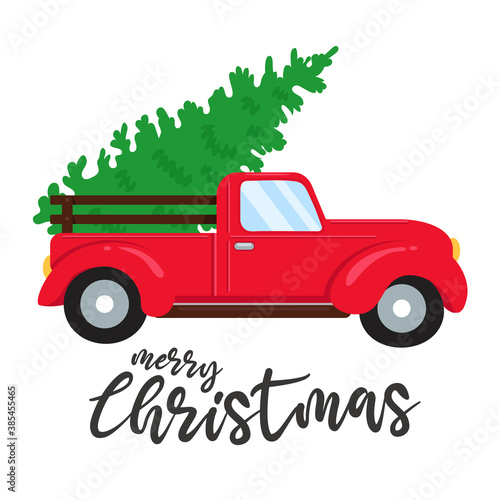 Christmas car. Red pickup truck carrying a Christmas tree.
