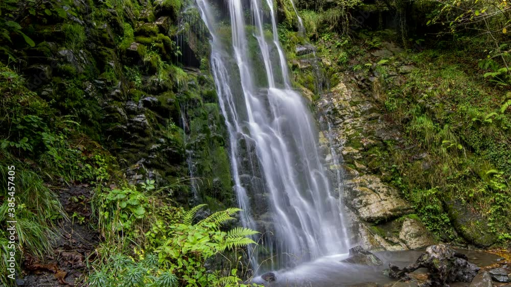 Time lapse loop of a waterfall, the water falls making silk effect Time lapse loop of a waterfall, the water falls making silk effect