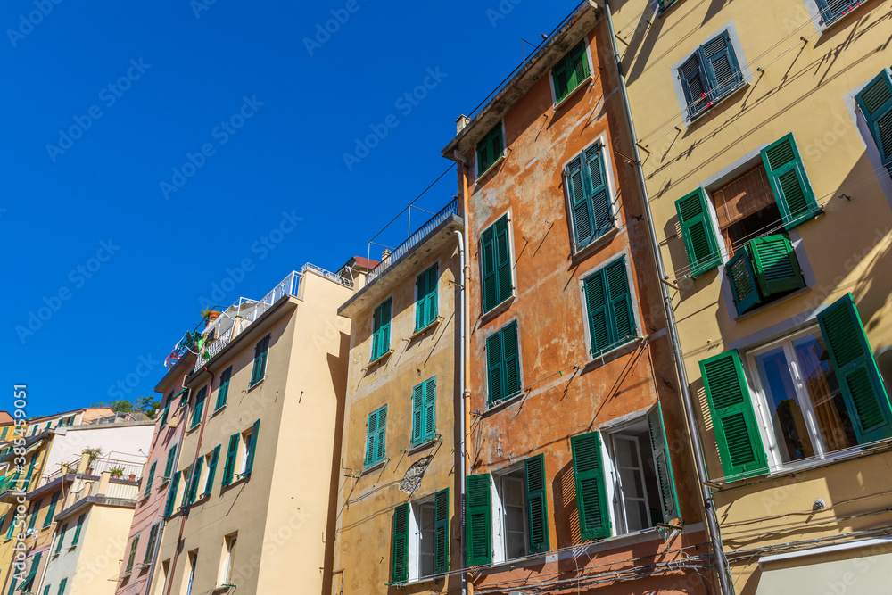 Ancient colorful houses. Perspective of the external facades of the buildings. Location: Riomaggiore in Liguria in Italy.