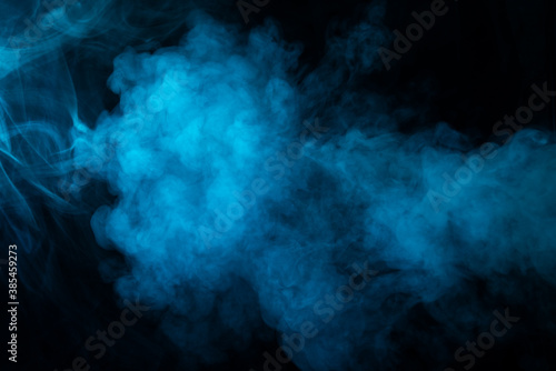 Texture of blue smoke on black background © olegkruglyak3