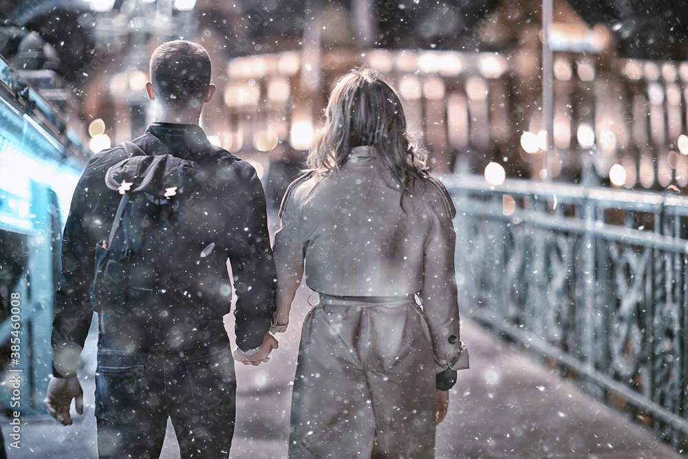 couple in love winter Budapest, tourism Hungary, a young couple a walk around the city in the evening couple in love winter Budapest, tourism Hungary, a young couple a walk around the city in the evening