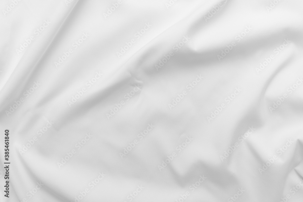 Abstract white fabric texture background. Cloth soft wave. Creases of satin. silk and cotton.