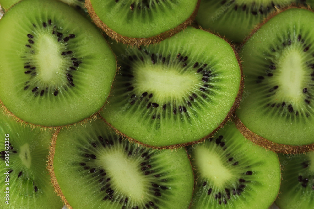 Top view of sliced kiwi as background Top view of sliced kiwi as background
