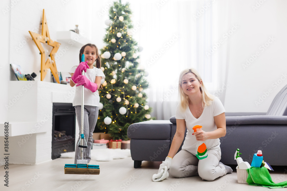 daughter and mother cleaning the apartment before christmas daughter and mother cleaning the apartment before christmas