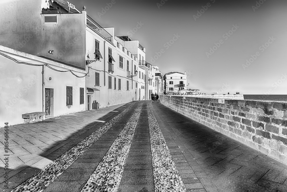 Walking on the historic ramparts in Alghero, Sardinia, Italy